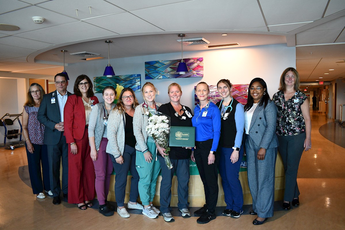 DAISY Award Recipient Megan Griffin, RN with her nursing colleagues and leaders