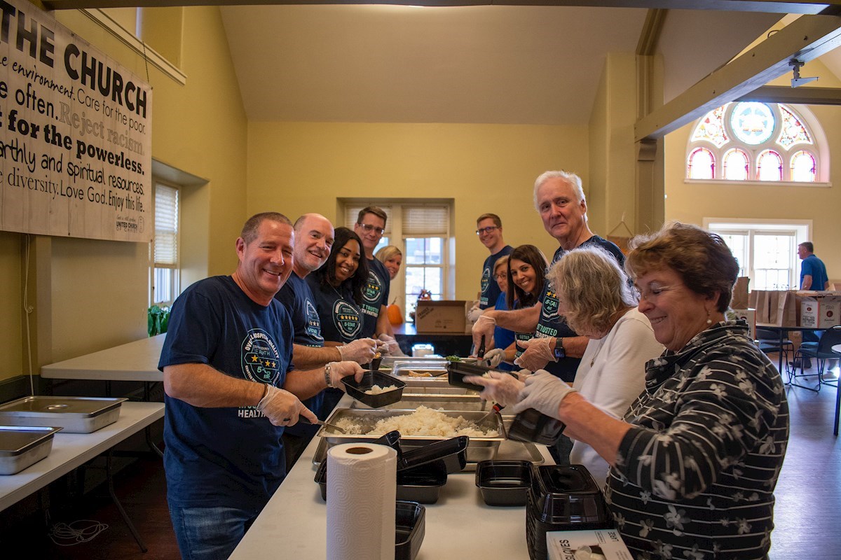 Leaders Volunteer with Kitchen of Hope