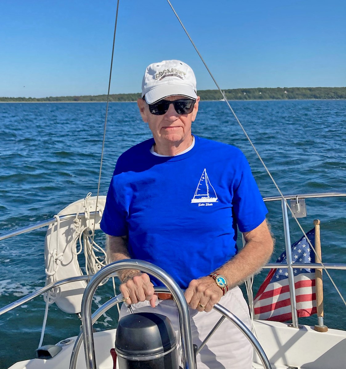 Ed Cunnie steers his sailboat.